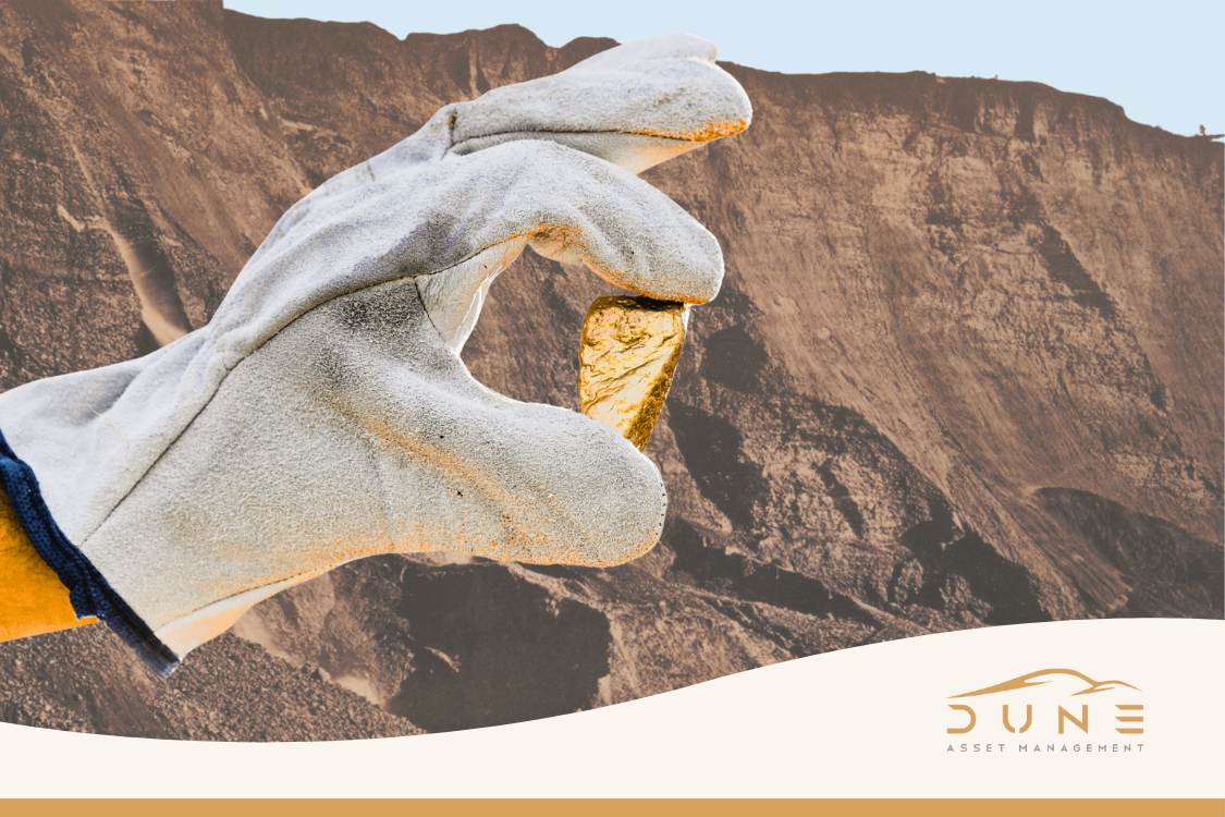 Cover image of a gloved hand holding a nugget of gold at a gold mine